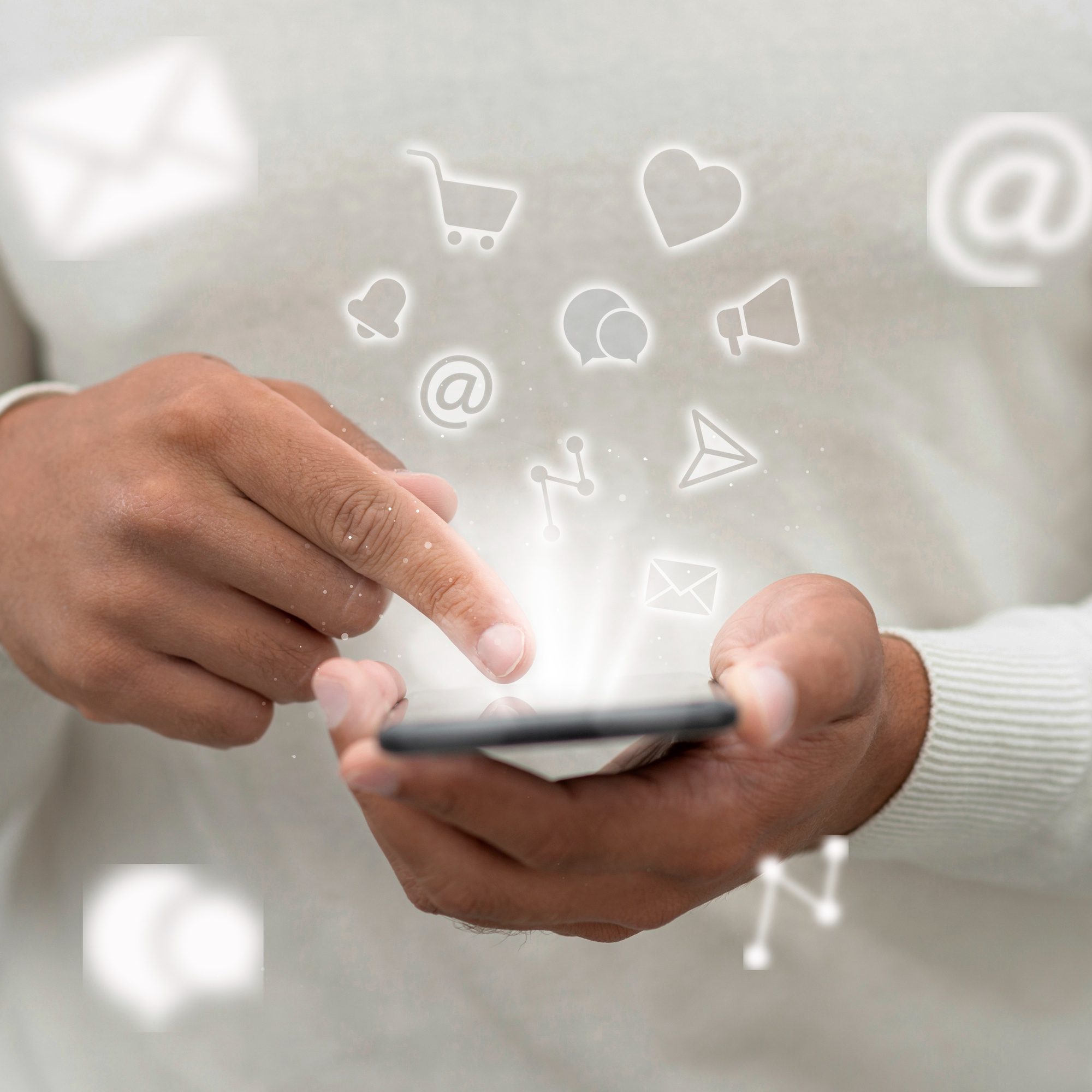 Social media icons floating from a smartphone, representing community engagement in acupuncture marketing services