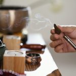 Acupuncturist engaging with online community on social media.